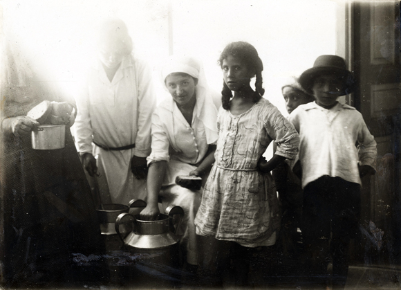 Food from Hadassah's Central Kitchen was distributed to JDC-supported centers throughout Jerusalem. Additionally, bread was provided daily for thousands of school children and orphans. Palestine, c. 1920, <em>NY_00002</em>.
