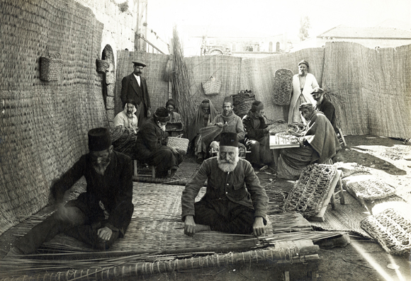 This successful workshop in basket and mat-weaving gave employment to elderly men and drew government contracts. JDC helped obtain other types of government work projects in road building, stone cutting, and drainage improvement for the 1200 - 1500 refugees arriving each month in Palestine. Palestine, c. 1920, <em>NY_00091</em>.
