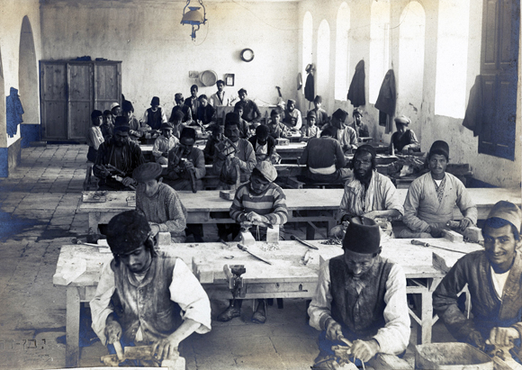 Urban industry in Palestine had been limited largely to souvenirs and religious articles. This workshop for unskilled labor in Jerusalem, established before the war by the Nathan Straus Foundation, made buttons and curios from locally-found shells and stones. With JDC funding, the workshop expanded to employ more workers, including older orphans. Palestine, c. 1921, <em>Lavan Dov Studios, NY_00131</em>.
