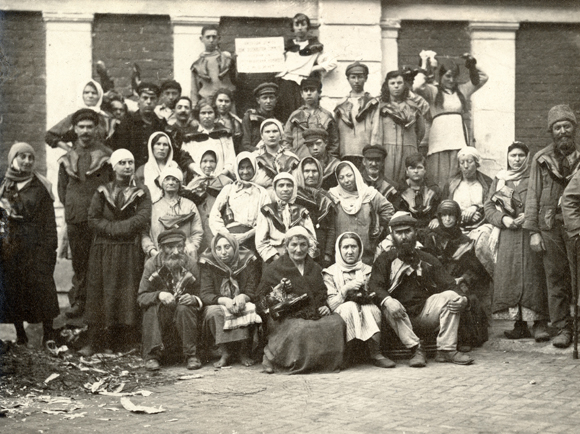 Shoes and clothing -- from underwear to overcoats -- became treasures beyond reach due to sky-rocketing prices, devalued currency, and curtailed production. These desperate people in Moscow received shoes from JDC. Russia, c. 1920, <em>NY_00589</em>. 
