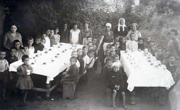 Colonies for restoring children's health focused on refugees and orphans. After years of war and pogroms, JDC decided that additional colonies were crucial. In 1920, around 25,000 children attended summer colonies, such as this one in the town of Soroka. Romania, c. 1920, M. Cligher, <em>NY_00974</em>.

