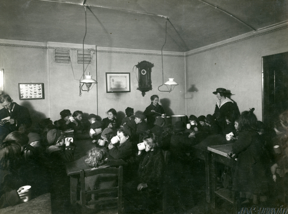 At a milk station in Vienna, refugee Jewish children drank their daily supply of warm milk. Local children in need of supplemental nutrition were also served. Austria, 1919, <em>NY_01244</em>.
