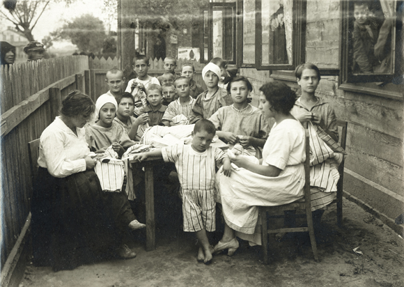 Children & teachers in a JDC-supported orphanage kindergarten in Brest. Poland (now Belarus), c. 1921, <em>NY_01444</em>.

