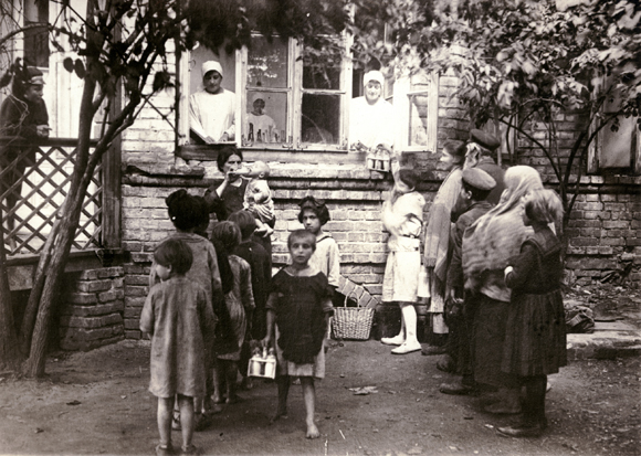 During the war, OZE had sent doctors, nurses, and nutritionists to bring emergency medical relief to refugees and other displaced persons in Russian-held territories. With JDC's expanded funding, OZE ran clinics, hospitals, canteens, children's nutrition centers, milk stations, kindergartens, summer camps, and playgrounds in the war's aftermath. An OZE Milk Station in Bialystok focused on infants and young children. Poland, c. 1921, <em>NY_01724</em>. 
