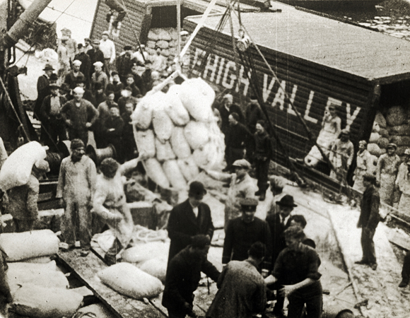 In 1919, JDC 's first ARA shipment traveled on the U.S.S. <em>Westward-Ho</em> with 3,500 tons of rye flour, 1,500 tons of condensed milk, 1,000 tons of packaged goods, 500 tons of cottonseed oil, and $100,000 worth of children’s clothing. The $2 million cargo was heavily financed by JDC. While all Poles were eligible to receive aid, Jews formed a large percentage of those in need. U.S., 1919, <em>NY_03479</em>.  
