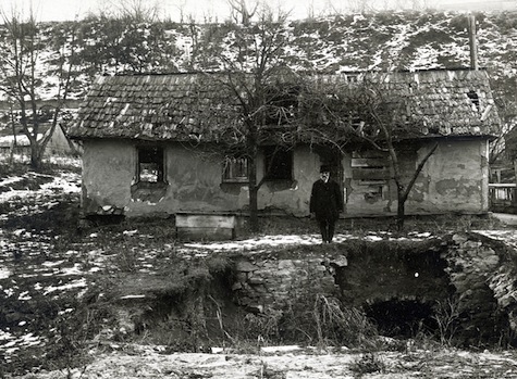 As hundreds of thousands of refugees returned to their former homes, they often found an empty shell or bare ground. By May 1920, $100,000 had been apportioned to repair partially ruined houses in Bukovina, Bessarabia, and Romania. In some towns, like Suczawa (Bukovina), destruction was too great for repairs. This man was one of the homeowners seeking loans to completely rebuild. Romania, c. 1920-1921, <em>NY_04612</em>.
