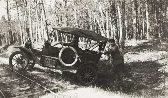 Cities and towns could be reached by trains (where they were still operating), but JDC staff depended on cars and trucks to reach hundreds of more isolated villages and to move quickly from one place to another. Still, most motor vehicles of that time were open to the elements, required hand-cranking to start the engine, and reached a top speed of 40-45 mph. Roads could not be counted on, either. Poland, c. 1920, <em>NY_05102</em>. 
