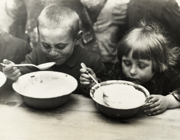 For many children, soup and bread at a JDC-subsidized soup kitchen had been the only meal of the day. But as funds and conditions in Eastern Euopean countries allowed, JDC's child care work continually expanded. A functionally structured Child Care Department was launched in Fall 1920. Eastern Europe, c. 1920, <em>Underwood and Underwood, NY_07225</em>. 
