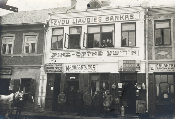 Beginning in 1920, the  branches of the cooperative Jewish Volksbank served as JDC's agents in Lithuanian cities like Kedainai, and for nearby towns that had no bank of their own. These in turn could loan money to cooperatives, which provided food, clothing, fuel, and raw materials for free or very low prices. Lithuania, c. 1923, <em>NY_07381</em>.
