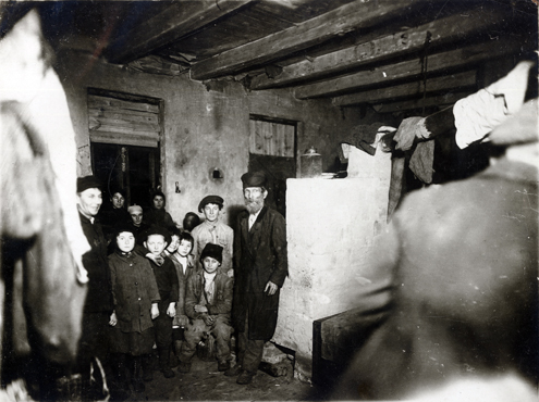 Desperate for a place to rest, exhausted refugees often crowded into makeshift shelters with no beds, like this synagogue in Brest. Such conditions spread disease quickly. One typhus epidemic was traced to four Ukrainian refugees sleeping in a synagogue in Rovno. Poland (now Ukraine), c. 1919, <em>NY_14476</em>.
