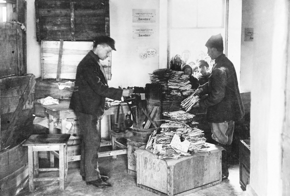 Soviet era constraints on religious observance limited JDC’s role. Where possible however, assistance was given to support rabbis and religious groups. JDC subsidized the purchase of flour for the baking of matzah so that needy Jews in the Ukraine could celebrate Passover in the midst of great hardship. Distributing matzah from a Kharkov warehouse, Ukraine, c. 1923, <em>NY_00419</em>.