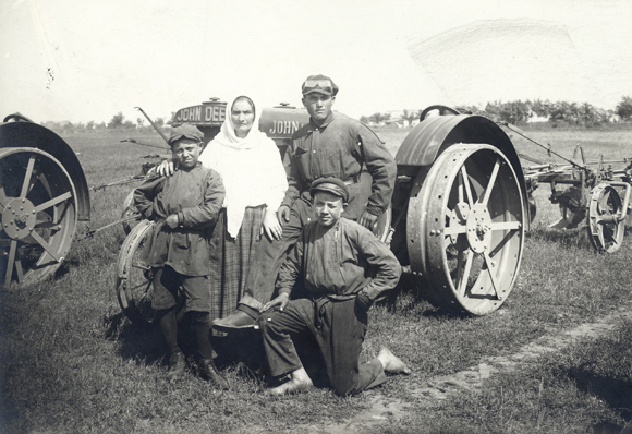 Most colonies were built on abandoned and undeveloped land, untamed by plows. To help ease settlement on such hard ground, Agro-Joint acquired thousands of modern American tractors for the new colonies. Skilled operators were brought in to train settlers in their use. Although tractors were not owned by individual families, they were much appreciated. Ukraine, c. 1925, <em> NY_00768</em>.  