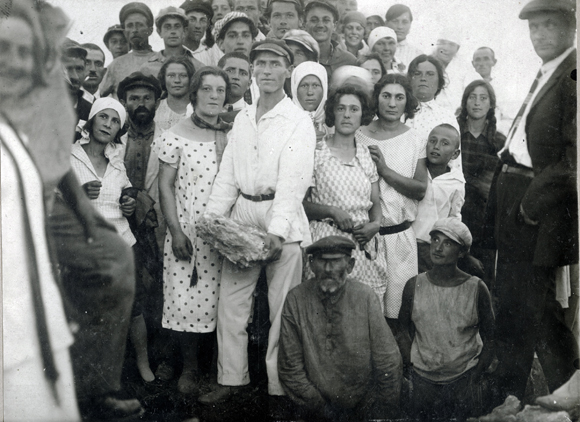 As soon as Jewish colonies were established, settlers wanted education for their children. Agro-Joint- supported schools had Jewish teachers and classes taught in Yiddish, the official language of the colonies. Russian and Ukrainian language classes were introduced in the higher grades. Colonists in the Krivoy Rog district proudly celebrated the cornerstone laying for a new school. Ukraine, 1927, <em>NY_43352 (from YIVO)</em>.