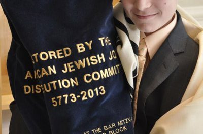 A White Plains bar mitzvah boy reads from a 200-year-old Belgrade Torah