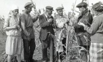 Agronomist Samuil Mazo, one of the Agro-Joint staff accused of 'counter-revolutionary activities,' with farmers. Ukraine, 1930s.